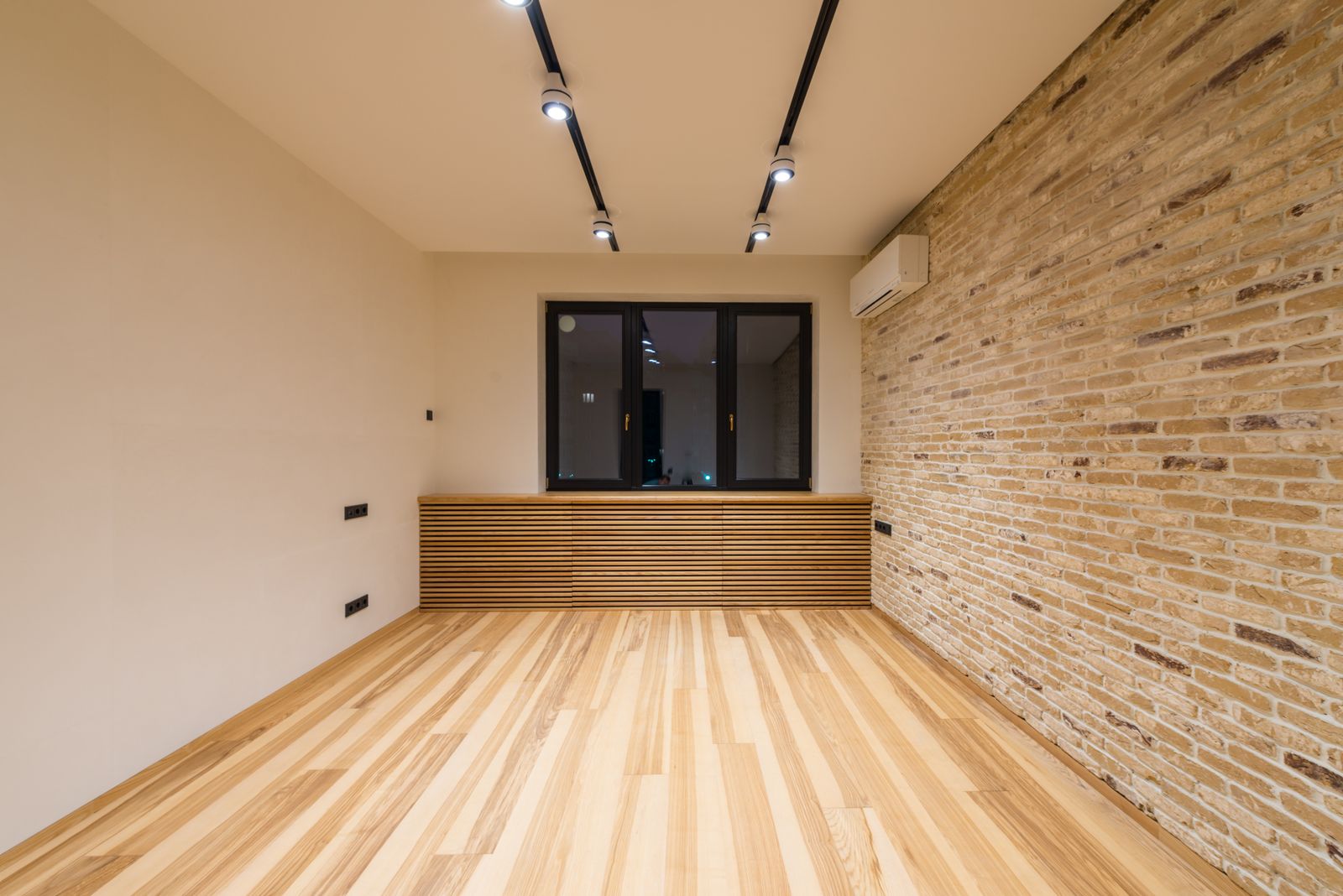 Sample image of an empty room with track lighting on the ceiling
